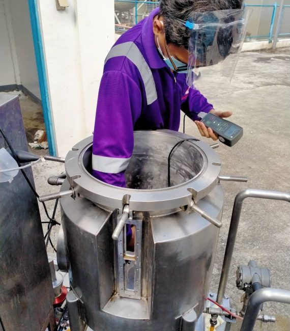 hardness-testing-man-wearing-purple-uniform-performing-hardness-testing